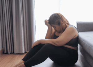 Illustration représentant une personne souffrant de boulimie, confrontée à des crises alimentaires, une perte de contrôle et une souffrance psychologique liée aux troubles des conduites alimentaires.